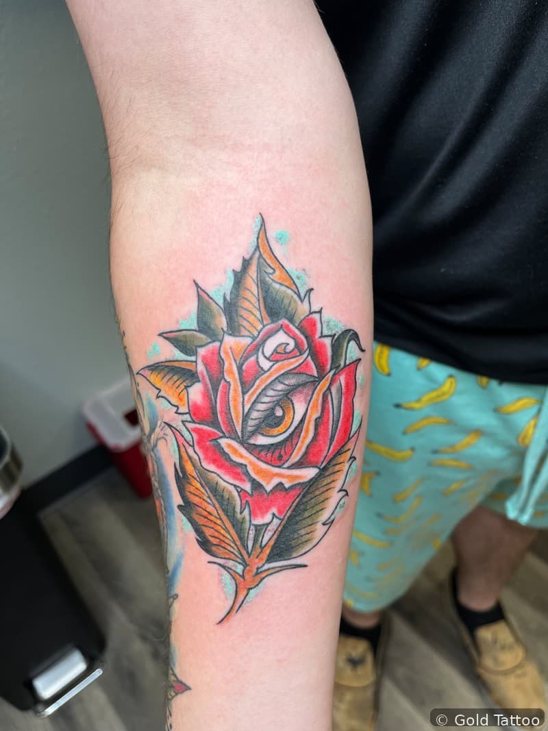 Color rose tattoo on a forearm by Nathan at Gold Tattoo, 1506 S Las Vegas Blvd, Unit 3