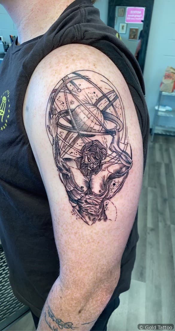 Black and grey skull tattoo on an upper arm by Nathan at Gold Tattoo, 1506 S Las Vegas Blvd, Unit 3