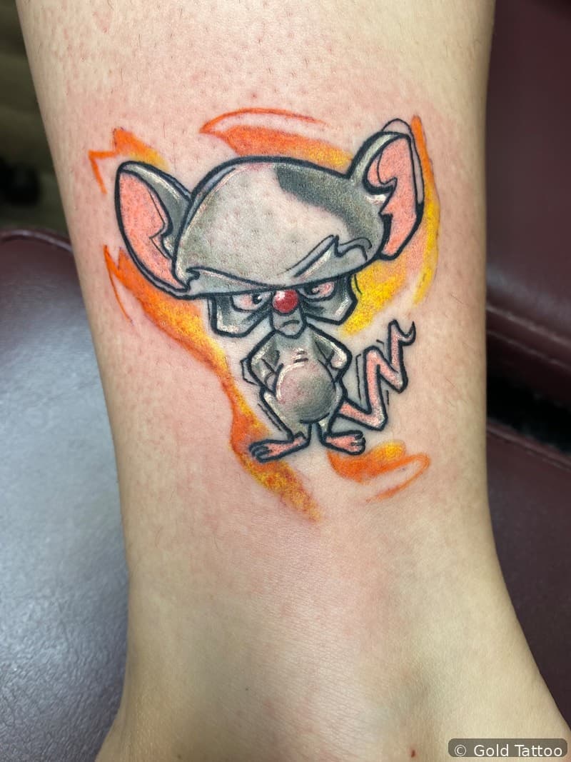 Color cartoon character tattoo on a leg by Nathan at Gold Tattoo, 1506 S Las Vegas Blvd, Unit 3