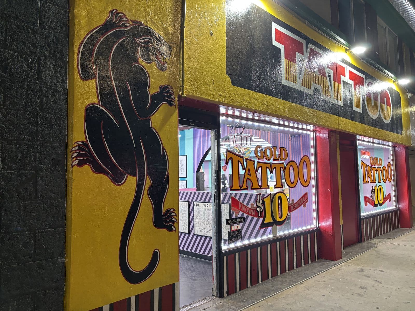 Gold Tattoo Vegas storefront at night at 1506 S Las Vegas Blvd, Unit 3, near the STRAT on the Las Vegas Strip